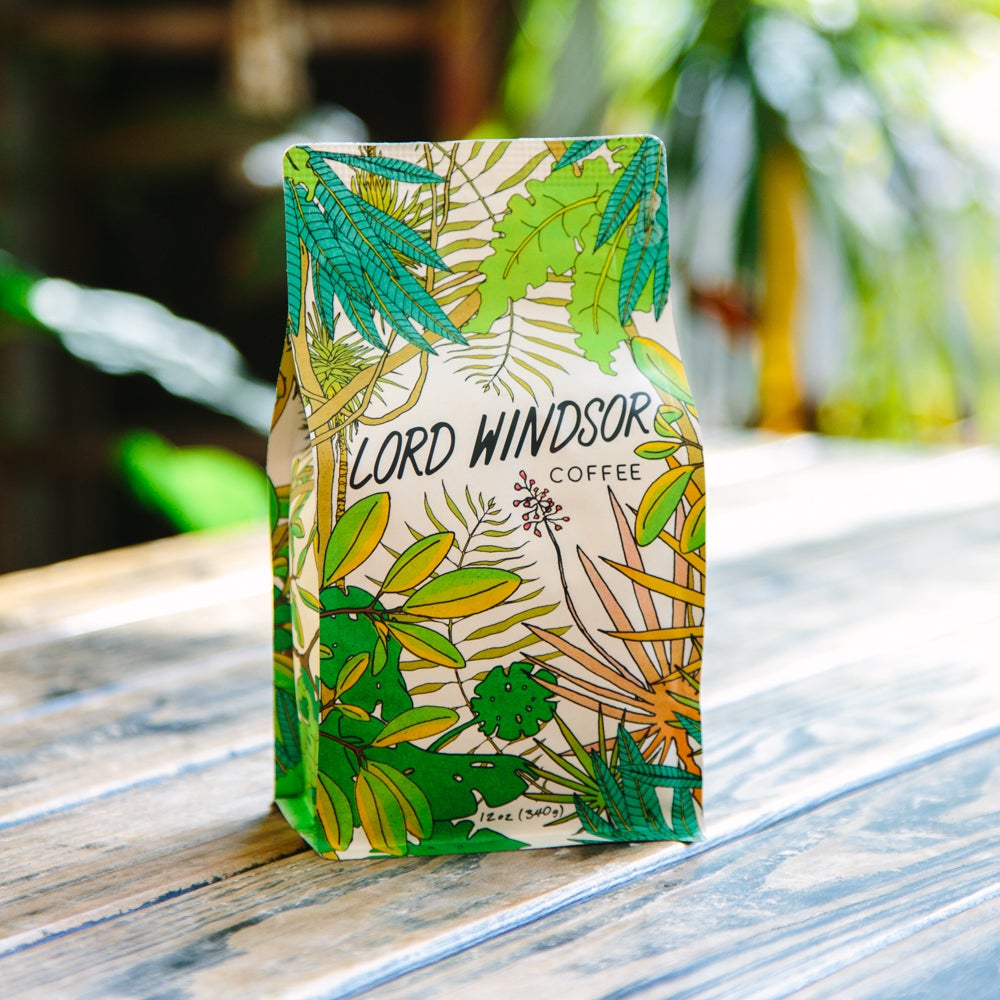 A white bag of coffee beans from Rosso Coffee Roasters